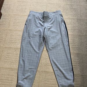 Athleta Brooklyn pant with a black check and a black stripe down side